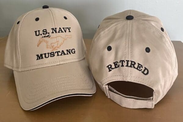 A cap that says u. S. Navy mustang retired