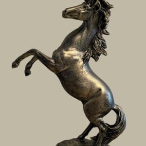 A horse statue is shown in bronze.