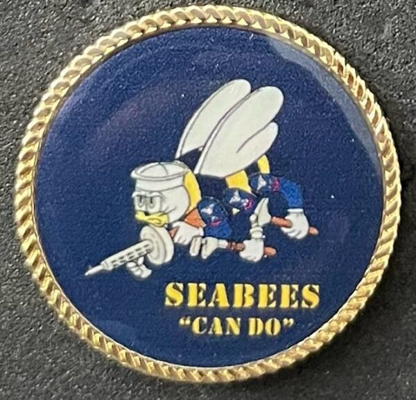 A navy seal patch with the words " seabees can do ".