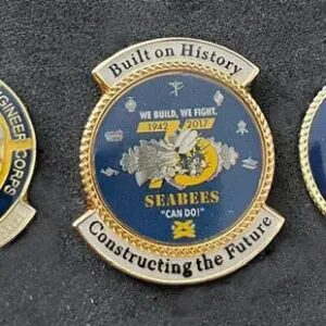 A group of three pins that are on the ground.