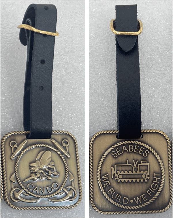 A black leather strap with a gold metal tag.