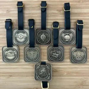 Navy Seabees brass belt buckles on display.